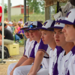 Boys on the bench in the dug out