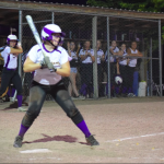 Girl waiting to hit ball