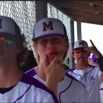 Boys in dug out making faces at the camera