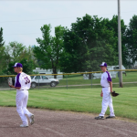 Boys baseball players in the field