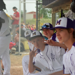 Boys on the bench making faces