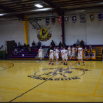 Boys basketball players shaking hands