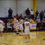 Boys basketball players greeting their own team when called introduced