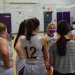 Girls basketball players in huddle